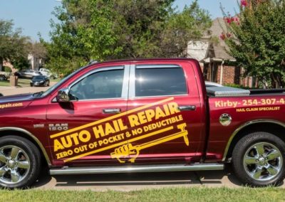 Work truck with custom vinyl decals.